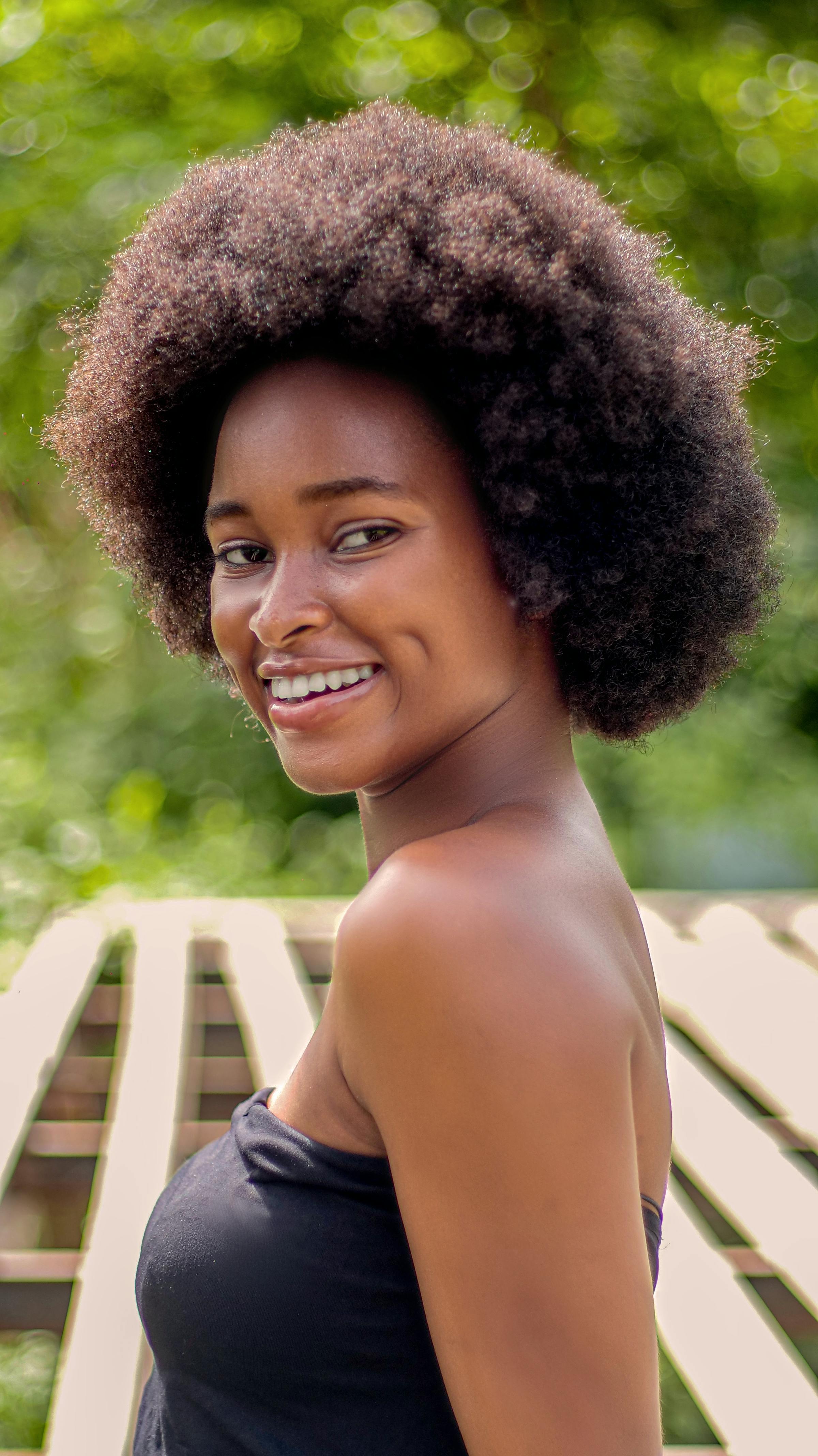 A confident young woman wearing her natural afro